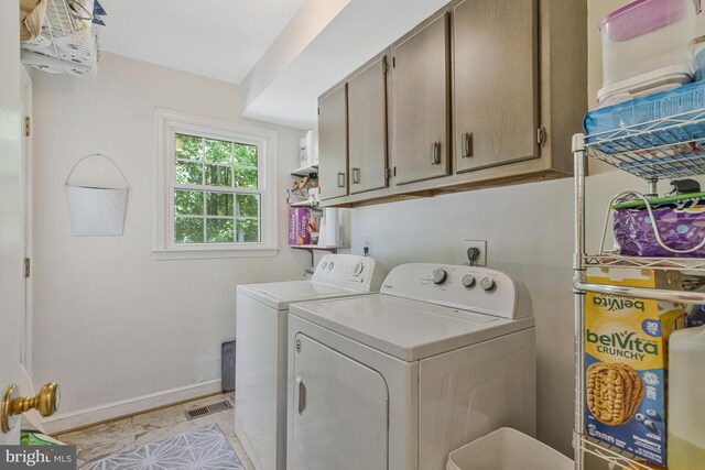 1202 Forestville Dr, Great Falls, VA 22066 - washroom with cabinet space and washer and clothes dryer