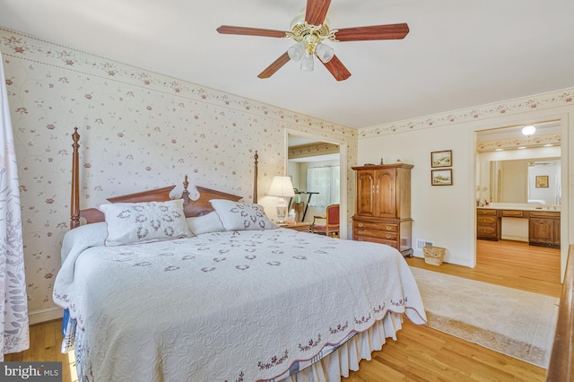 1202 Forestville Dr, Great Falls, VA 22066 - bedroom with light wood-type flooring, wallpapered walls, ensuite bathroom, and ceiling fan