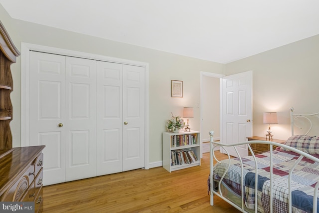 1202 Forestville Dr, Great Falls, VA 22066 - bedroom with light wood-style floors and a closet