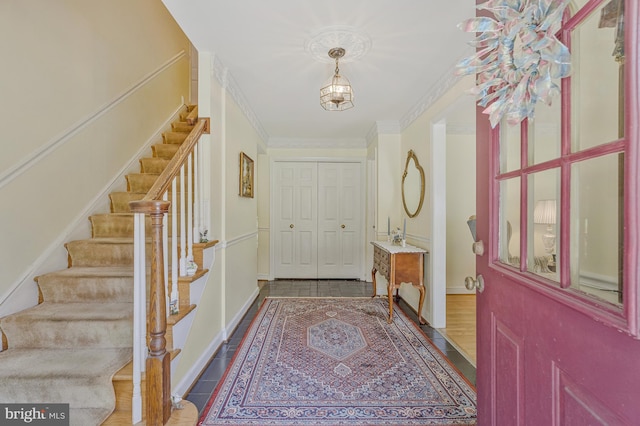 1202 Forestville Dr, Great Falls, VA 22066 - entryway featuring stairs, dark tile patterned flooring, and ornamental molding