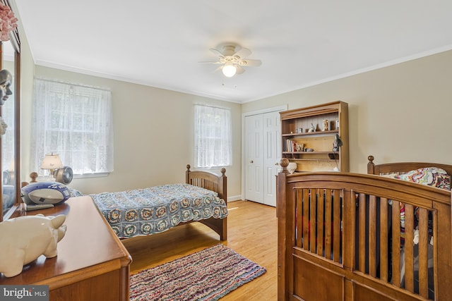 1202 Forestville Dr, Great Falls, VA 22066 - bedroom featuring a closet, light wood-style floors, ornamental molding, and a ceiling fan