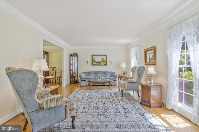 1202 Forestville Dr, Great Falls, VA 22066 - living area featuring plenty of natural light, ornamental molding, and wood finished floors