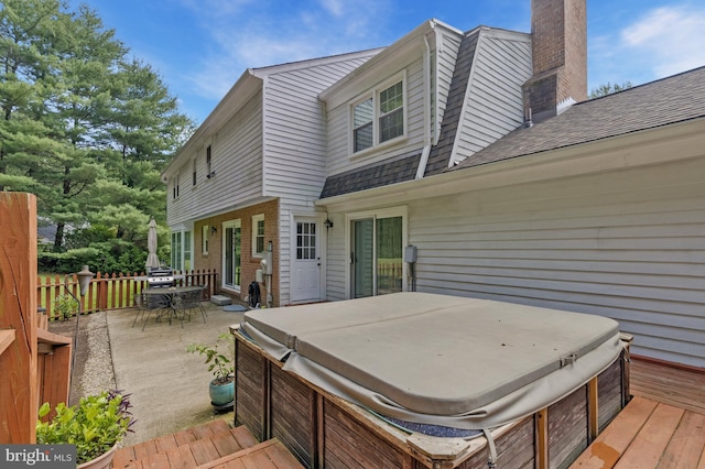 1202 Forestville Dr, Great Falls, VA 22066 - wooden deck with a hot tub and outdoor dining area