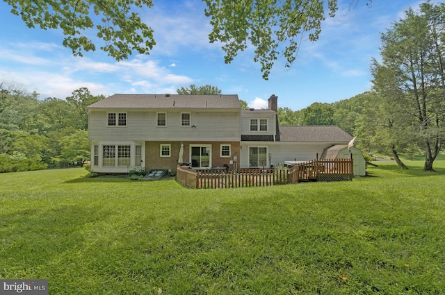 1202 Forestville Dr, Great Falls, VA 22066 - rear view of house featuring a wooden deck, a lawn, a chimney, and brick siding