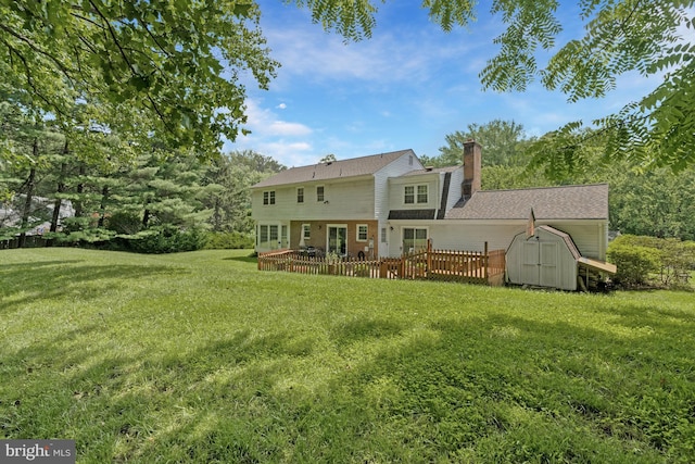 1202 Forestville Dr, Great Falls, VA 22066 - back of house with a storage unit, a lawn, a deck, and a chimney