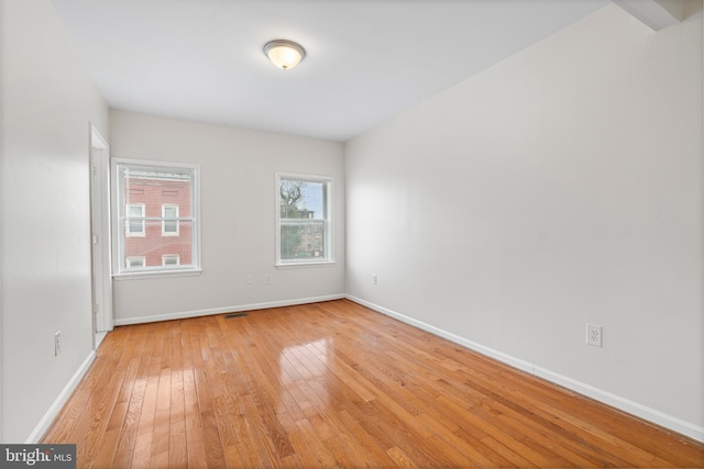 1401 Druid Hill Ave, Baltimore, MD 21217 - unfurnished room featuring light wood-style flooring and baseboards