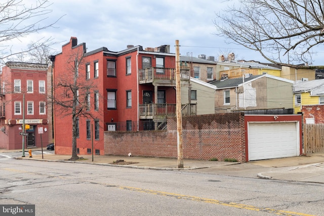 1401 Druid Hill Ave, Baltimore, MD 21217 - view of building exterior with an attached garage and concrete driveway
