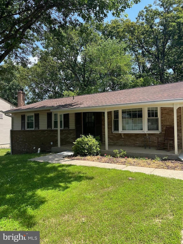 12157 Pineneedle Ct, Woodbridge, VA 22192 - ranch-style house with brick siding, a front lawn, a chimney, and a porch