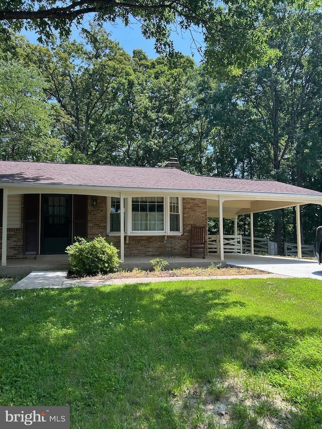 12157 Pineneedle Ct, Woodbridge, VA 22192 - single story home with brick siding, a front lawn, a carport, and concrete driveway