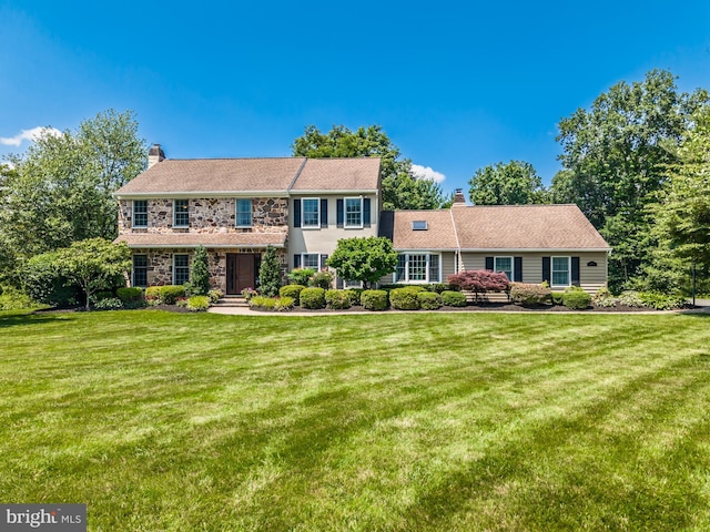 20 Mooney Ln, Chester Springs, PA 19425 - colonial inspired home featuring a chimney, stone siding, and a front yard