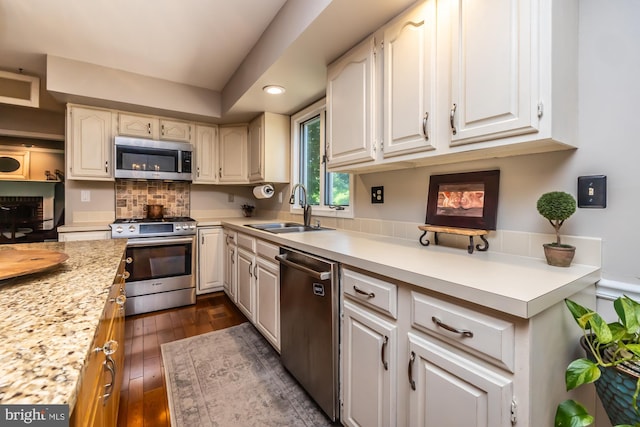 20 Mooney Ln, Chester Springs, PA 19425 - kitchen featuring stainless steel appliances, light countertops, dark wood finished floors, white cabinetry, and recessed lighting