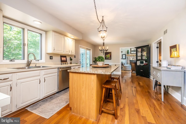 20 Mooney Ln, Chester Springs, PA 19425 - kitchen featuring dishwasher, a kitchen island, white cabinetry, and light wood-style floors