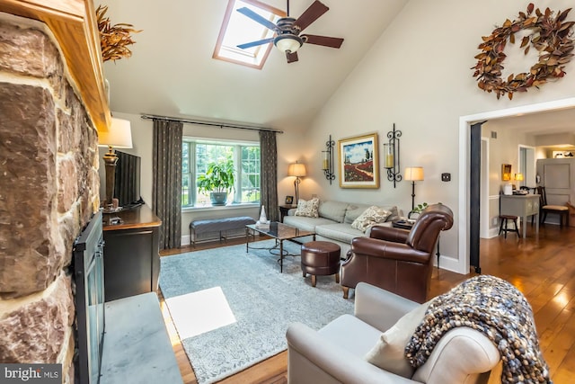 20 Mooney Ln, Chester Springs, PA 19425 - living room with a ceiling fan, hardwood / wood-style floors, high vaulted ceiling, a skylight, and a fireplace