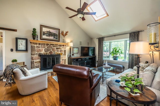 20 Mooney Ln, Chester Springs, PA 19425 - living area featuring high vaulted ceiling, a skylight, ceiling fan, hardwood / wood-style flooring, and a fireplace