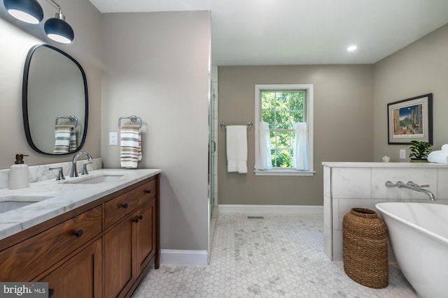 20 Mooney Ln, Chester Springs, PA 19425 - full bath with double vanity, a freestanding tub, a shower with door, recessed lighting, and tile patterned flooring