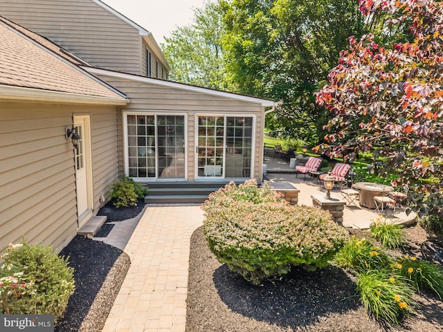 20 Mooney Ln, Chester Springs, PA 19425 - entrance to property with a patio area and roof with shingles