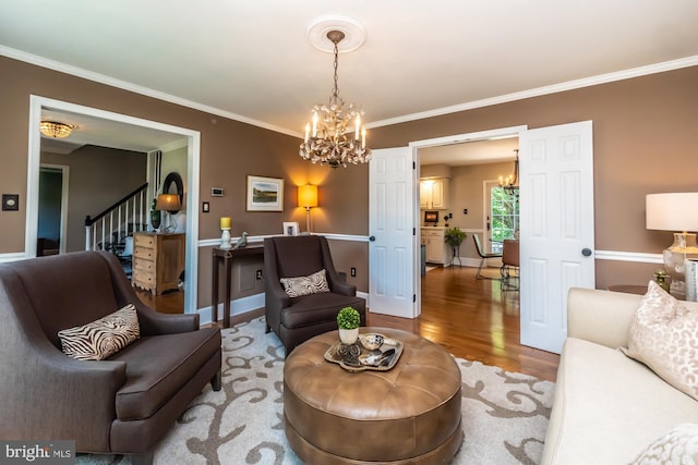 20 Mooney Ln, Chester Springs, PA 19425 - living room featuring a chandelier, wood finished floors, ornamental molding, and stairs