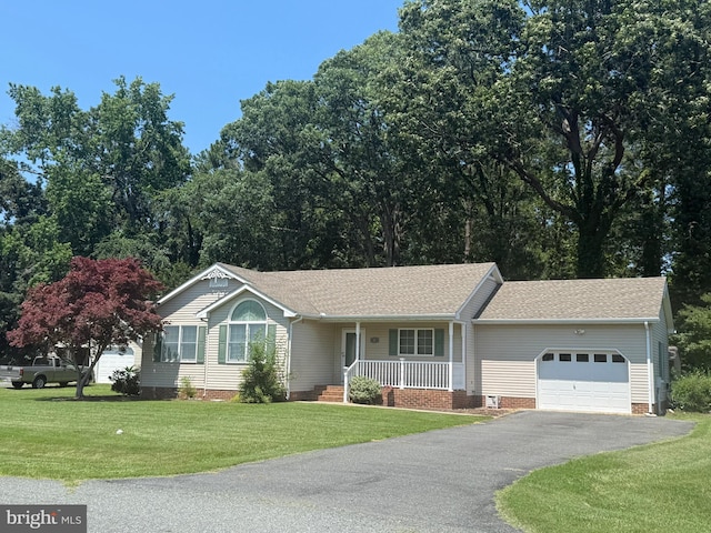 3 Holly Ter, Cambridge, MD 21613 - ranch-style home with a garage, covered porch, asphalt driveway, and a front lawn
