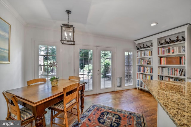 717 S Royal St, Alexandria, VA 22314 - dining space with french doors, wood finished floors, healthy amount of natural light, ornamental molding, and built in features