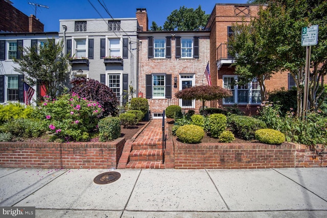 717 S Royal St, Alexandria, VA 22314 - townhome / multi-family property featuring brick siding and a chimney