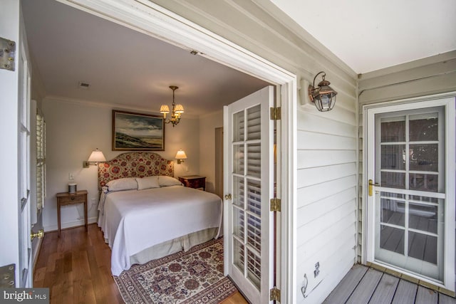 717 S Royal St, Alexandria, VA 22314 - bedroom with a chandelier, ornamental molding, and wood finished floors