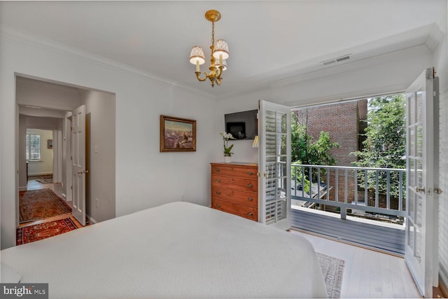 717 S Royal St, Alexandria, VA 22314 - bedroom with a chandelier, wood finished floors, crown molding, and access to outside