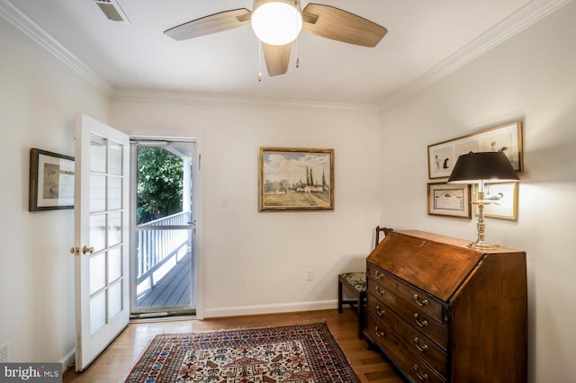 717 S Royal St, Alexandria, VA 22314 - foyer entrance featuring wood finished floors, ornamental molding, and a ceiling fan