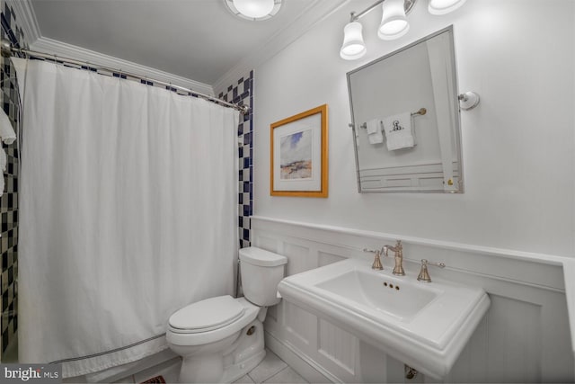 717 S Royal St, Alexandria, VA 22314 - bathroom with ornamental molding, tile patterned floors, curtained shower, a decorative wall, and a wainscoted wall