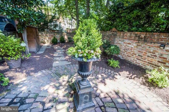 717 S Royal St, Alexandria, VA 22314 - fenced backyard with a patio area