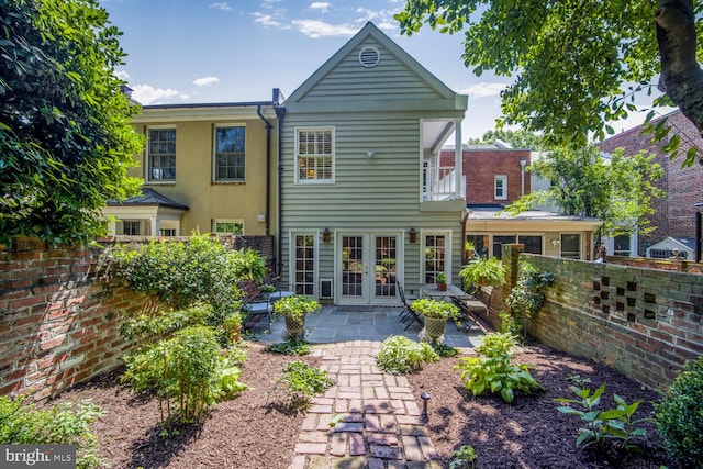 717 S Royal St, Alexandria, VA 22314 - back of property with french doors, a patio area, and a balcony