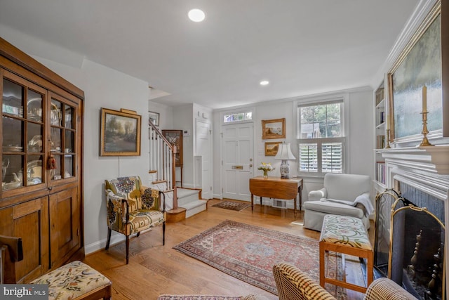 717 S Royal St, Alexandria, VA 22314 - living area featuring stairway, light wood-style flooring, a fireplace, and recessed lighting