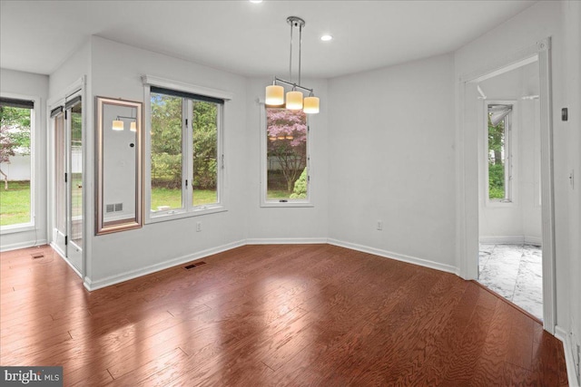 124 Kingsland Cir, Monmouth Junction, NJ 08852 - unfurnished dining area with wood finished floors and recessed lighting