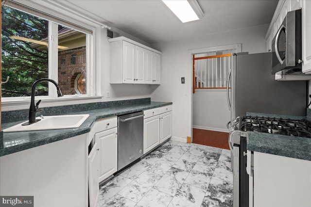 124 Kingsland Cir, Monmouth Junction, NJ 08852 - kitchen featuring stainless steel appliances, light marble finish flooring, white cabinetry, and dark countertops
