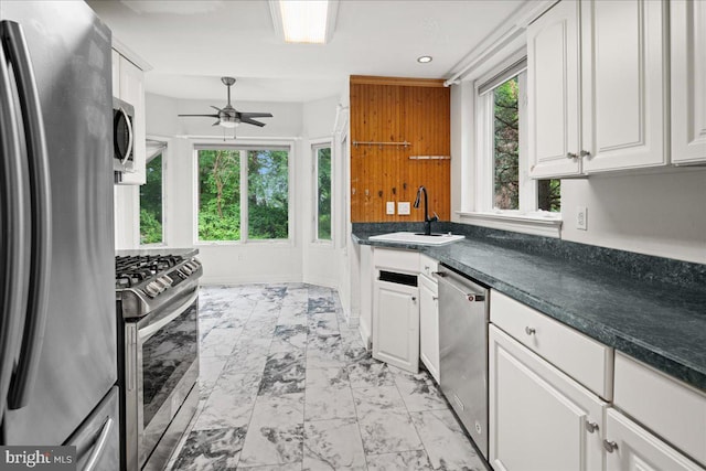 124 Kingsland Cir, Monmouth Junction, NJ 08852 - kitchen with appliances with stainless steel finishes, light marble finish floors, ceiling fan, white cabinetry, and recessed lighting