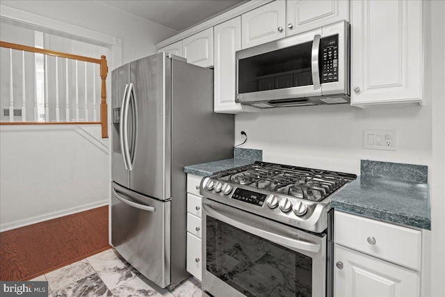 124 Kingsland Cir, Monmouth Junction, NJ 08852 - kitchen with appliances with stainless steel finishes, white cabinets, and dark countertops