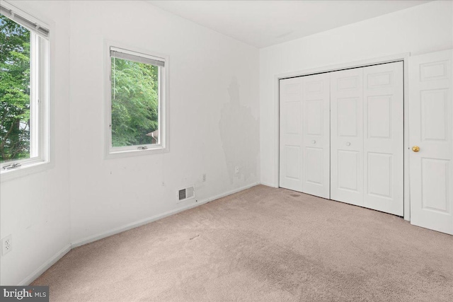 124 Kingsland Cir, Monmouth Junction, NJ 08852 - unfurnished bedroom featuring carpet flooring and a closet