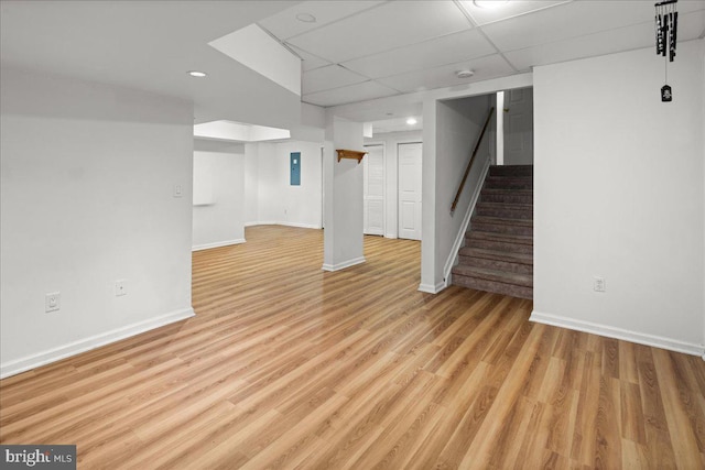 124 Kingsland Cir, Monmouth Junction, NJ 08852 - finished below grade area featuring a drop ceiling, stairs, light wood finished floors, and recessed lighting