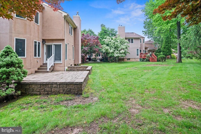 124 Kingsland Cir, Monmouth Junction, NJ 08852 - view of grassy yard with a patio and entry steps