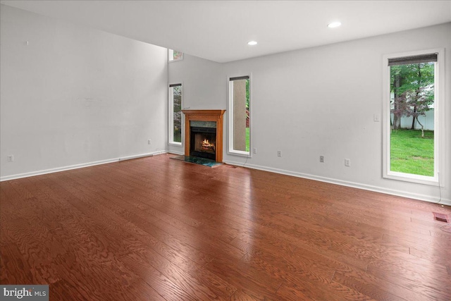 124 Kingsland Cir, Monmouth Junction, NJ 08852 - unfurnished living room featuring wood finished floors, a high end fireplace, and recessed lighting