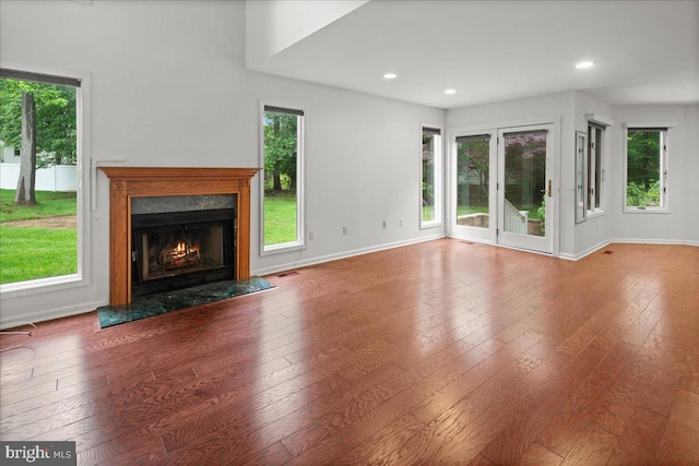 124 Kingsland Cir, Monmouth Junction, NJ 08852 - unfurnished living room with a premium fireplace, wood-type flooring, plenty of natural light, and recessed lighting
