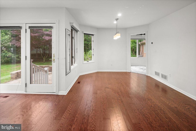 124 Kingsland Cir, Monmouth Junction, NJ 08852 - unfurnished dining area featuring wood finished floors and baseboards