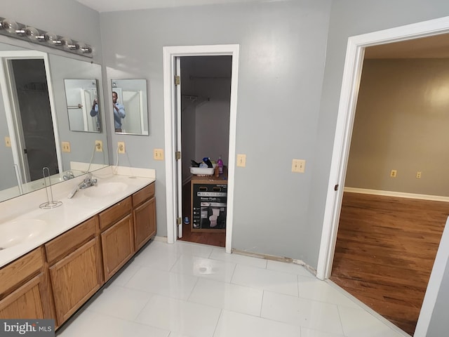 10203 Thundercloud Ct, Springdale, MD 20774 - full bathroom with double vanity and baseboards