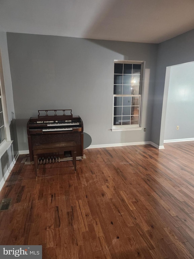 10203 Thundercloud Ct, Springdale, MD 20774 - sitting room with wood finished floors and baseboards