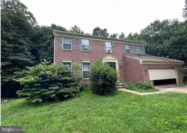 10203 Thundercloud Ct, Springdale, MD 20774 - colonial house featuring brick siding, an attached garage, driveway, and a front yard