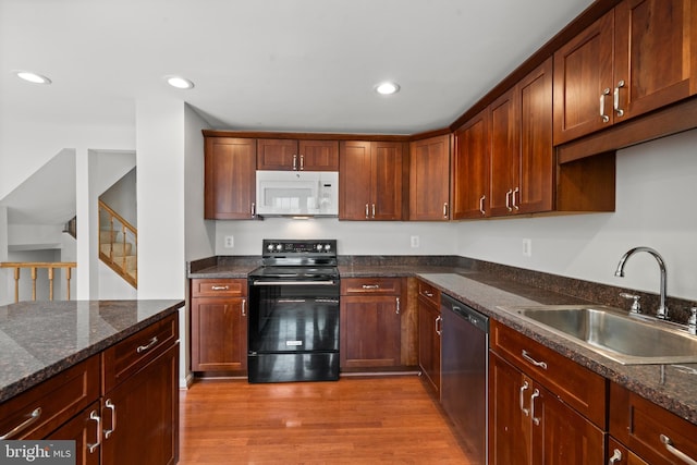 6558 Lochleigh Ct, Alexandria, VA 22315 - kitchen featuring white microwave, black electric range, dishwasher, wood finished floors, and dark stone counters