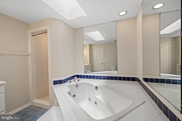 6558 Lochleigh Ct, Alexandria, VA 22315 - full bath featuring a skylight, vanity, a jetted tub, tile patterned flooring, and recessed lighting