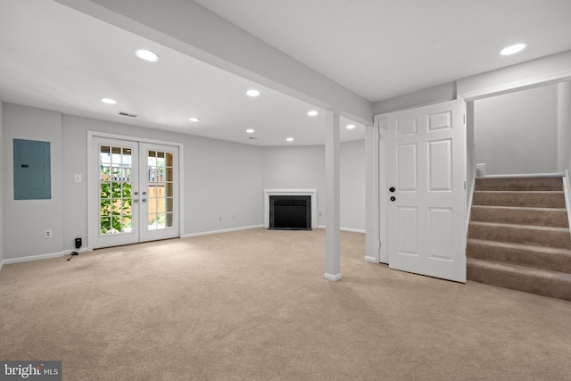 6558 Lochleigh Ct, Alexandria, VA 22315 - unfurnished living room featuring electric panel, recessed lighting, light carpet, stairs, and a fireplace with flush hearth