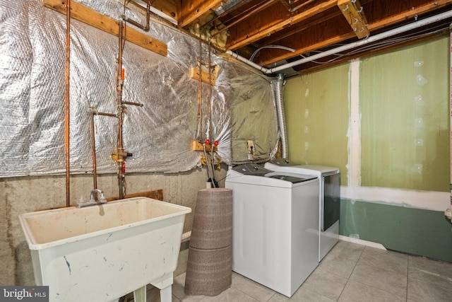 6558 Lochleigh Ct, Alexandria, VA 22315 - laundry area with washer and dryer and tile patterned floors