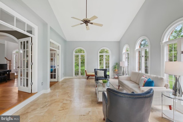 14309 Cervantes Ave, Darnestown, MD 20874 - living room featuring high vaulted ceiling, a ceiling fan, arched walkways, and french doors