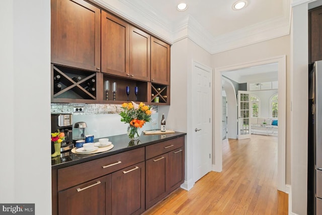 14309 Cervantes Ave, Darnestown, MD 20874 - bar featuring light wood-style floors, crown molding, recessed lighting, and arched walkways